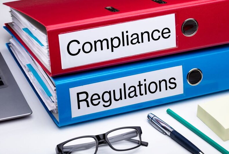 Compliance-And-Regulation-Folder-On-Office-Desk-1136317647_7912x5276