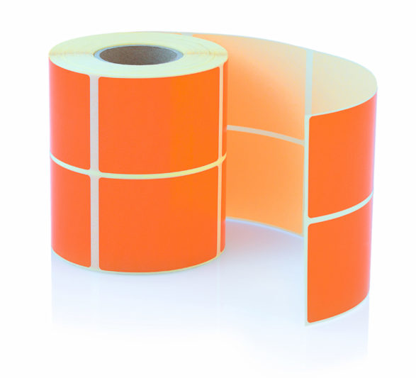 Orange label roll isolated on white background with shadow reflection. Color reel of labels for printers. Labels for direct thermal or thermal transfer printing.